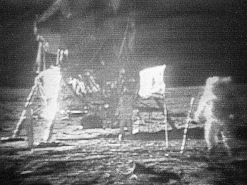 In this July 20, 1969, image made from television, Apollo 11 astronaut Neil Armstrong, right, trudges across the surface of the moon. Edwin E. “Buzz” Aldrin is seen closer to the craft..jpg